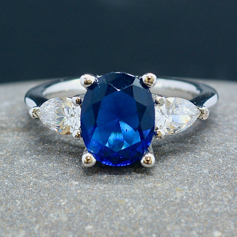 Trilogy Three-Stone Blue and Colourless CZ Sterling Silver Engagement Ring