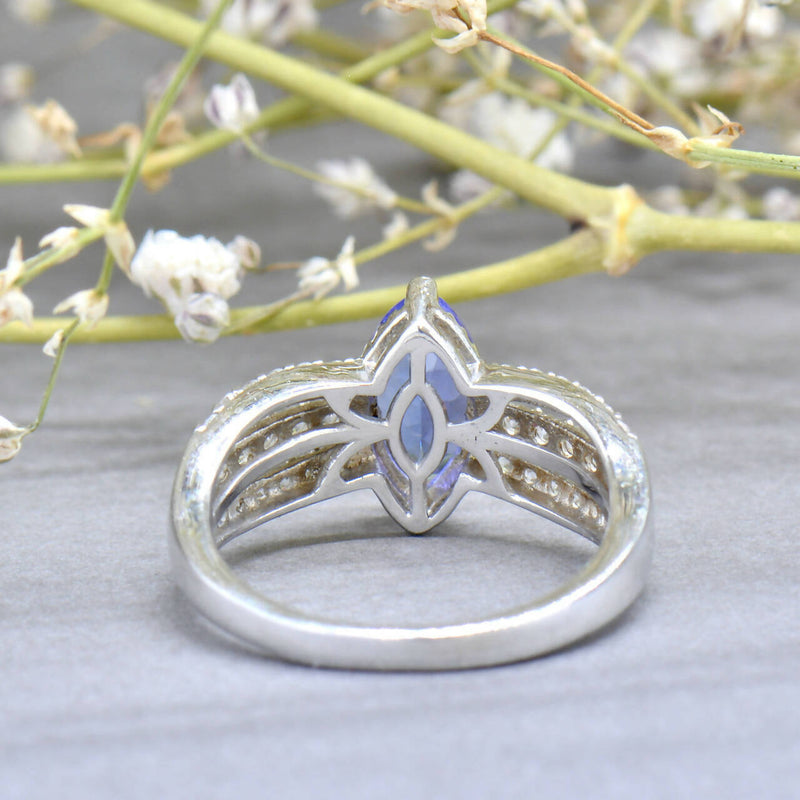 Tanzanite and White Zircons Silver Split Shoulders Design Ring